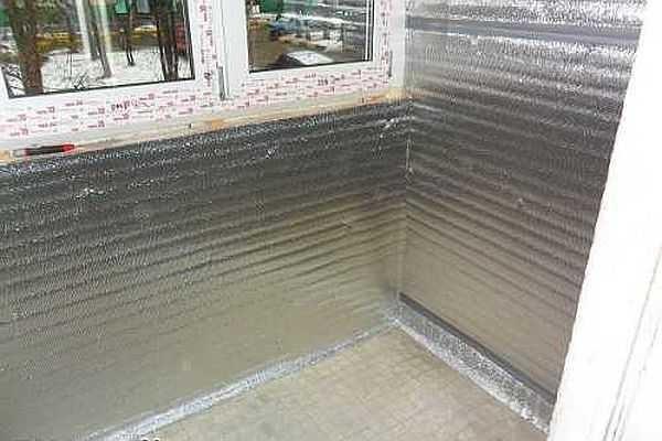 The foil polyethylene is nailed on top of the insulation to reduce heat loss and prevent vapor penetration into the insulation