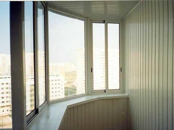 The photo shows a balcony covered with plastic - plastic wagons