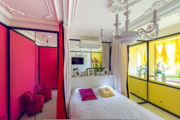 Bright bedroom decorated with stucco décor