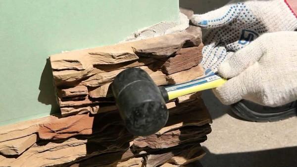 A rubber mallet can be used for better adhesion of the stone to the wall