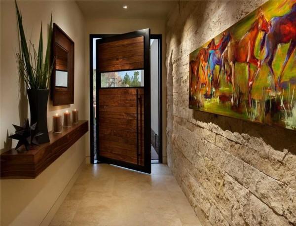 One of the walls in the hallway is decorated with decorative bricks