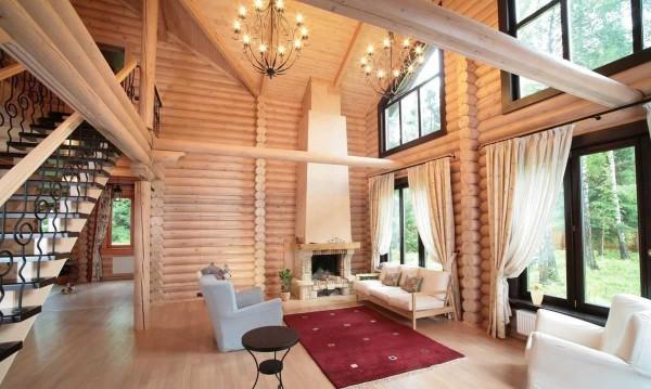 This is the interior of a house made of cylindrical logs. They are slightly whitened inside. The photo does not convey all the charms, but you can understand what we are talking about