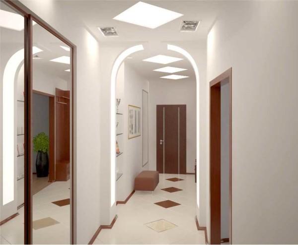 A long corridor is divided into zones by lighting and drywall arches - so it does not look so dull and monotonous