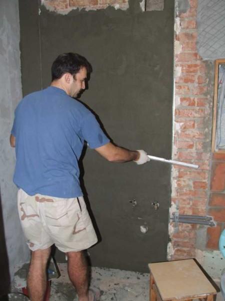 Plastering the walls 