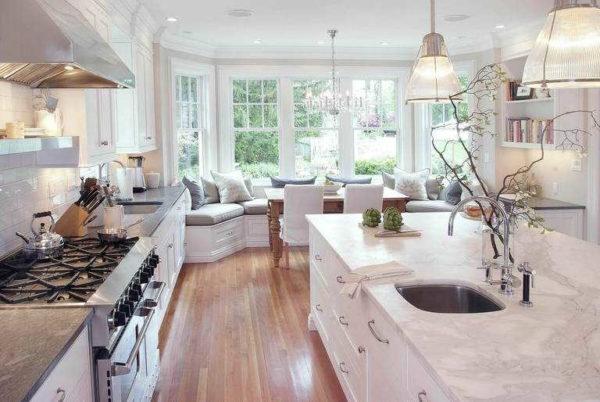 Large bay window kitchen design: island kitchen and sofa 