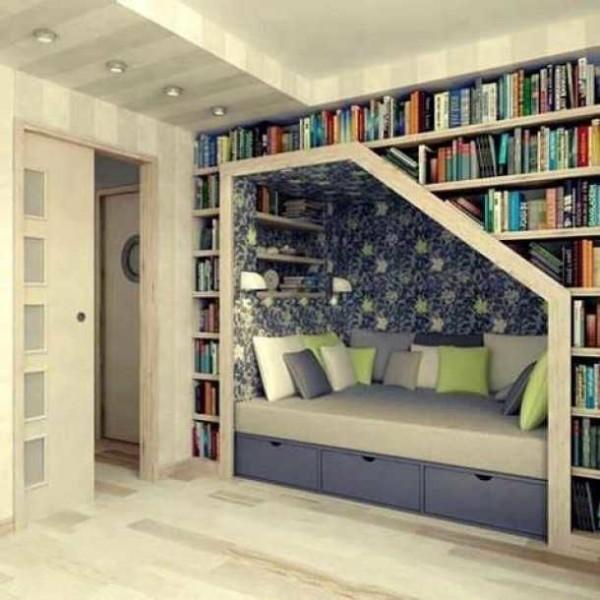 Use the space above the bed to store books 