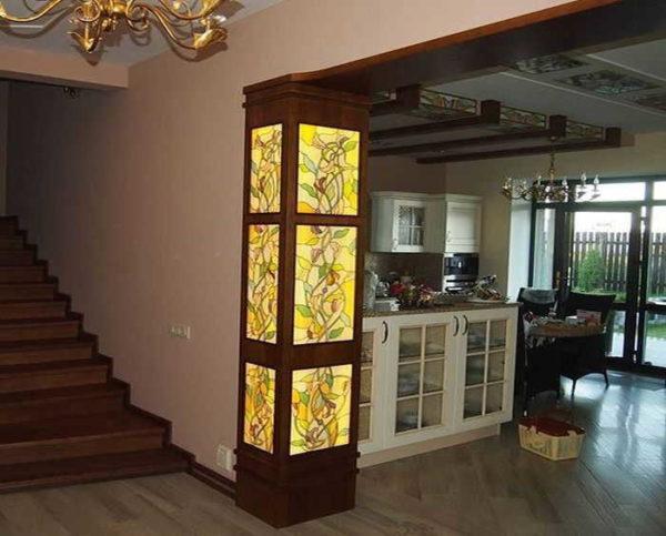 Stained glass semi-column with illumination. With the same ornamentation elements on the kitchen ceiling