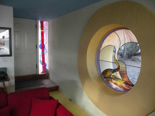 Unusually shaped window, and even with glass ornaments