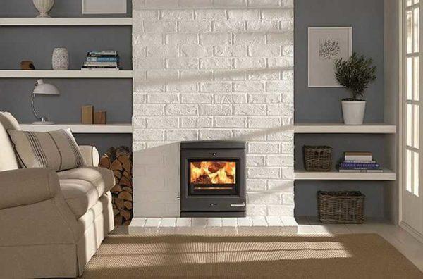 There are two options to achieve this effect - paint an existing brick fireplace or clad with clinker tiles