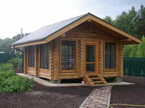 Summer kitchen made of logs