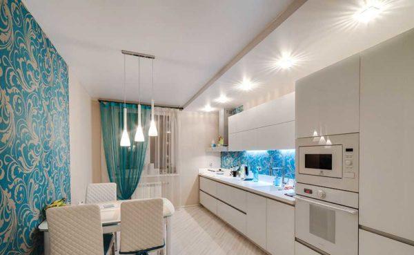 In the kitchen, a chandelier can be hung over the dining table, and the rest of the area can be illuminated with built-in lamps