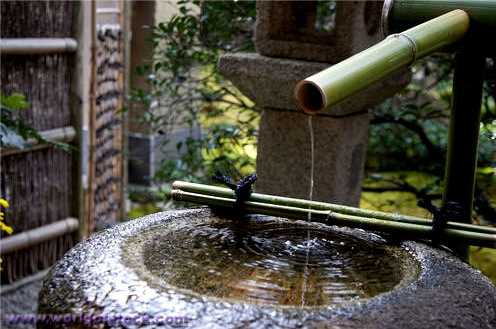 Outdoor fountain made of granite bowl and bamboo