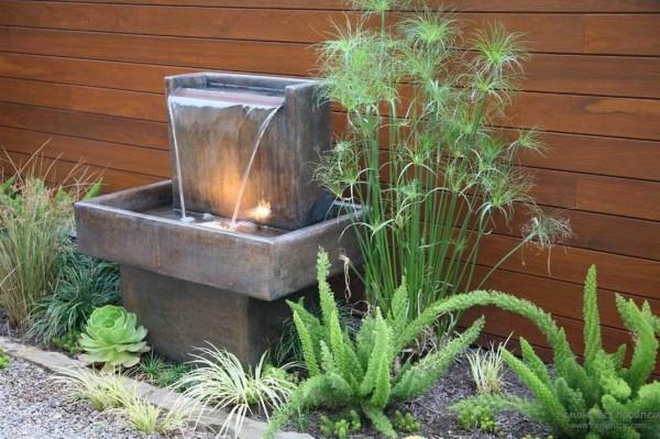 Beautiful fountain for summer cottage in the style of minimalism or modernism