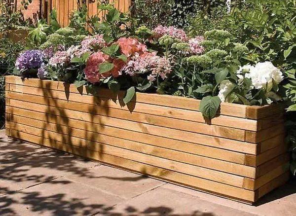 Outdoor flower vase made of timber