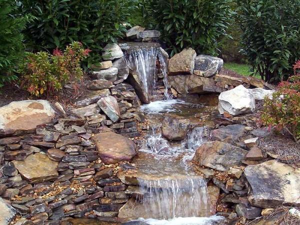 pond with waterfall with your own hands photo