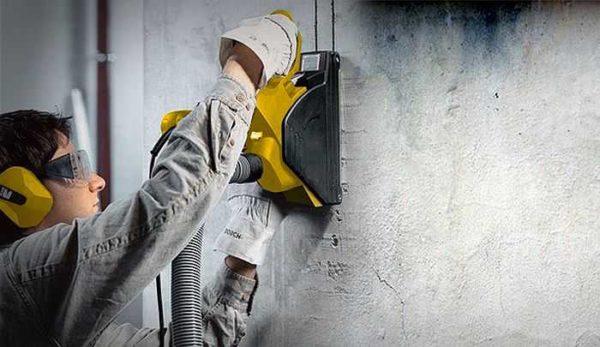 You must wear a respirator and protective clothing when drilling through walls