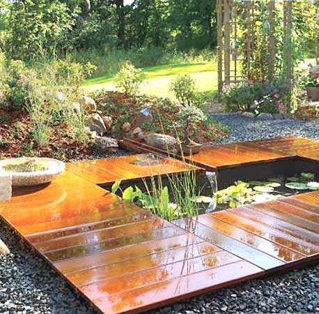 Decking around the pond - it will be comfortable to walk around even after a rainstorm