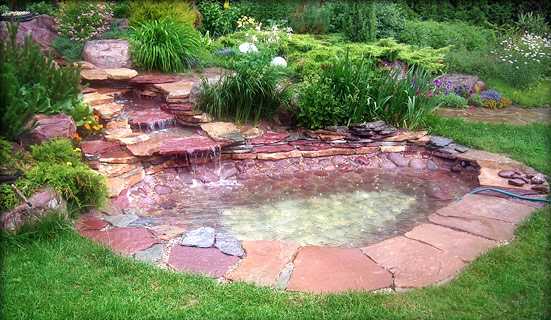 Beautiful red granite, and a stream as well. This garden ornament required patience to install and cost a decent amount of money 