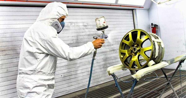 The process of applying powder paint to the part and then firing to cure