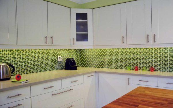 Apron, walls, countertop - two shades of green with basic white