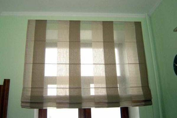 Roman blinds - rise from the bottom to the top, folding into pleats