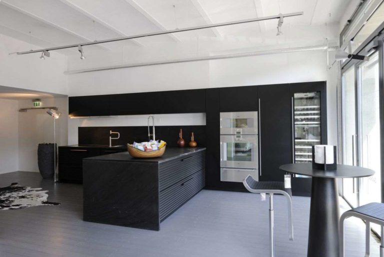 A black kitchen set requires space and plenty of light