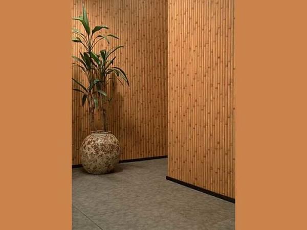 Bamboo wallpaper combines well with smooth vinyl of a close shade