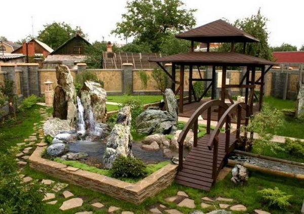 Backyard of a private home with a fountain and stream - stylish and beautiful