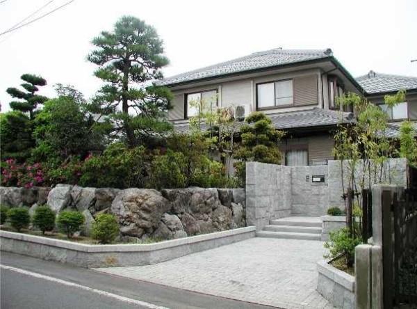 Japanese style decoration - abundance of stones and interesting conifers