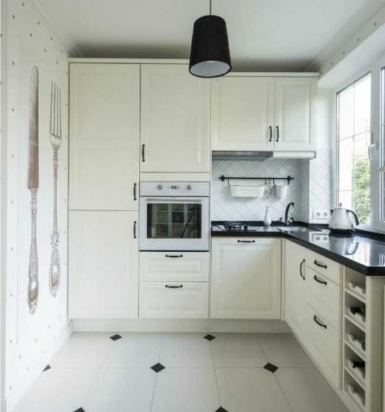 A white kitchen with small black accents is always relevant