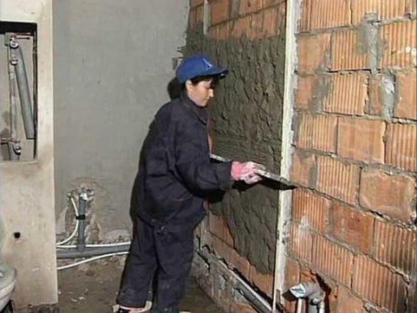 Bathroom walls are leveled with plaster on beacons