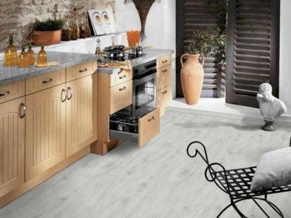 White linoleum in the kitchen with imitation wood flooring