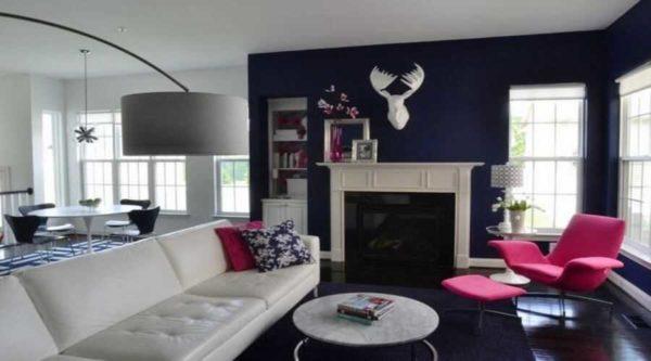 The rich cobalt blue, almost black color serves as a great backdrop for the fuchsia colored chair 