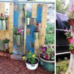 Even an old dry tree can be the basis for a vertical flower bed