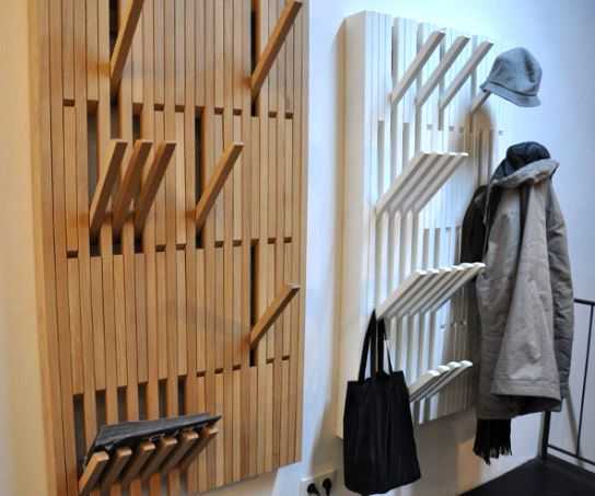 Wall hangers for hallways with folding hooks